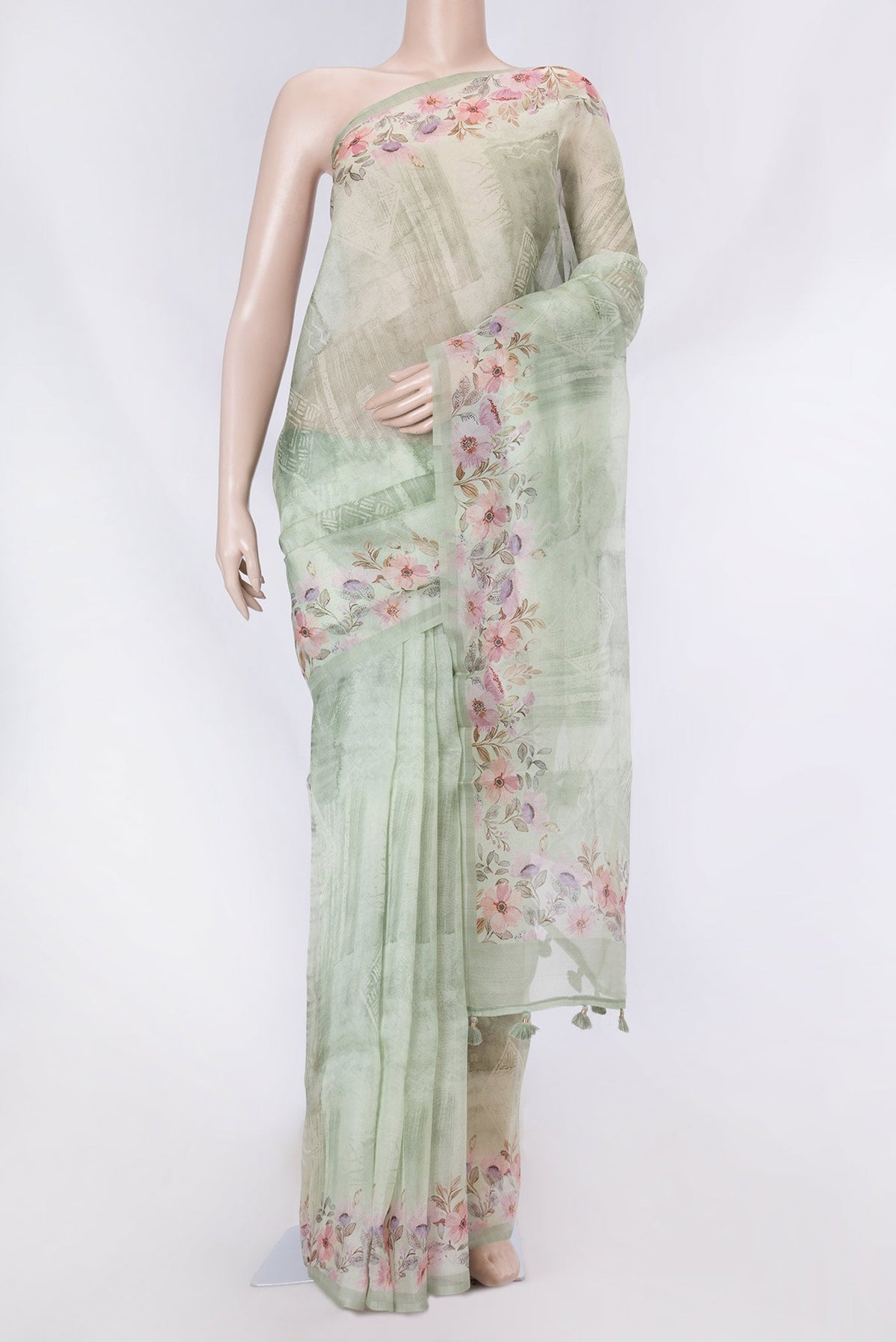 Pista Green Dual Tone Organza Silk Saree with Printed design on the body and Printed Border displayed on a mannequin