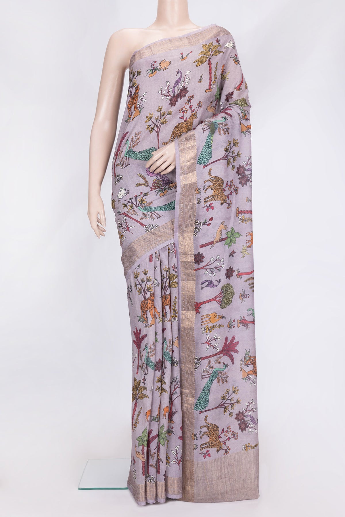 Lavender Dual Tone Tussar Silk Saree with Printed design on the body and Zari Border.  displayed on a mannequin