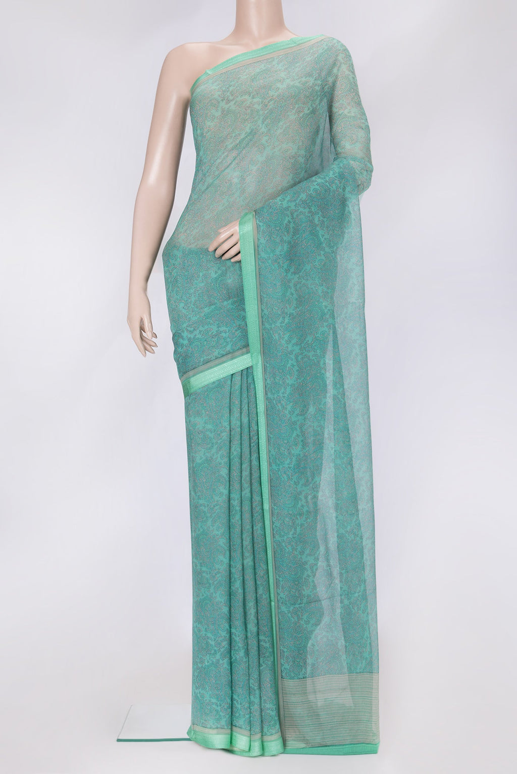 Sea Green Dual Tone Mysore Chiffon Saree with Printed design on the body and Thread Border.  displayed on a mannequin