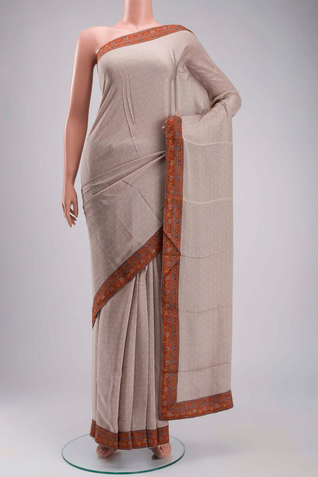 Grey Crepe Saree with Printed design on the body and Embroidery Border displayed on a mannequin