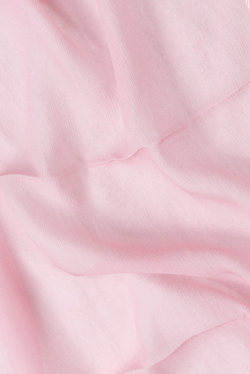 Close up of Pink Dual Tone Mysore Chiffon Saree with Plain Body and Printed Border.  displaying folds