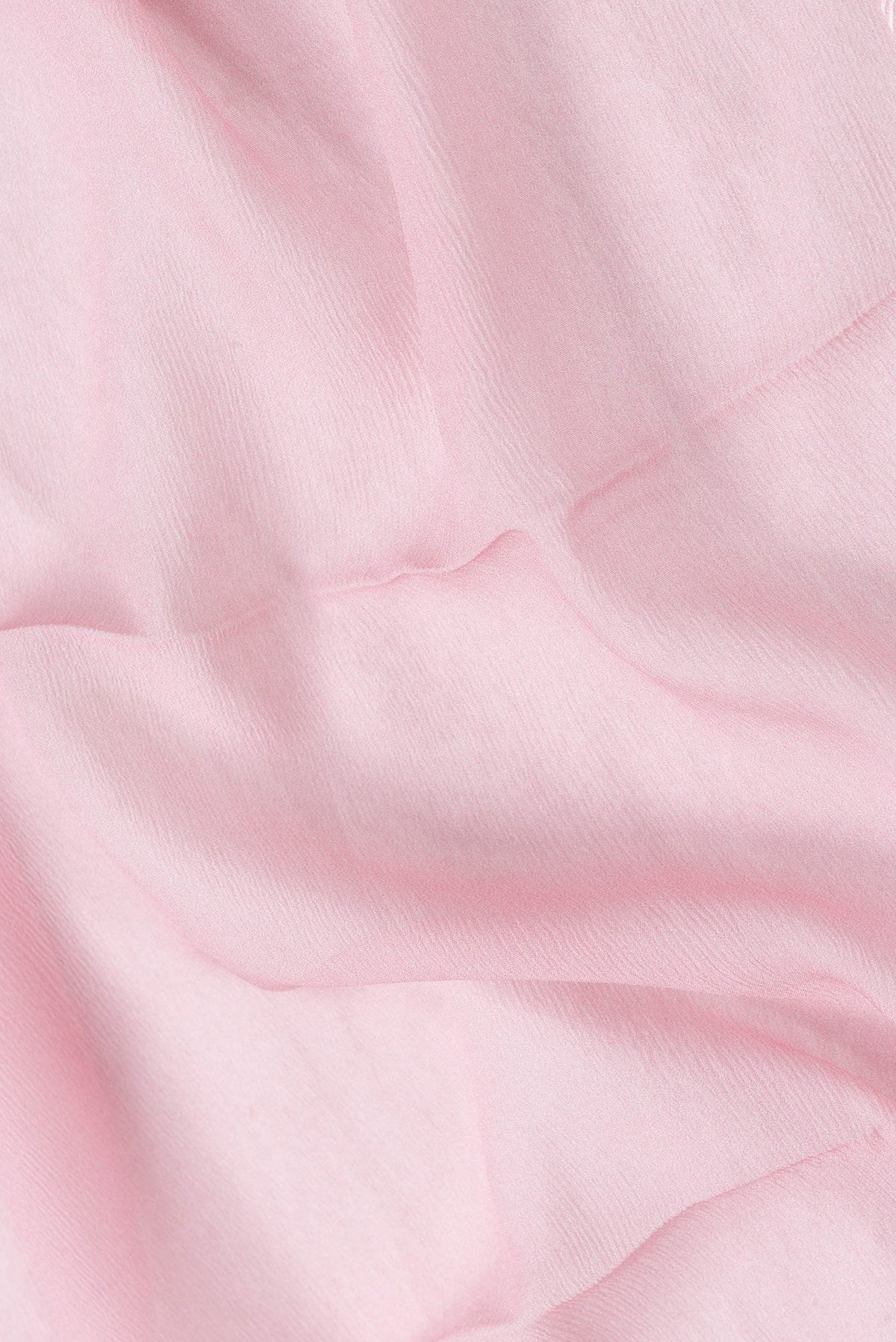 Close up of Pink Dual Tone Mysore Chiffon Saree with Plain Body and Printed Border.  displaying folds