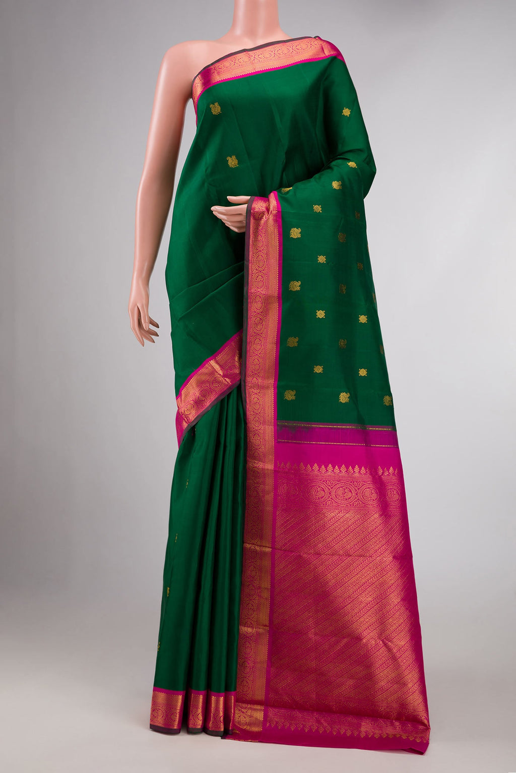 Bottle Green Dual Tone Kanchipuram Silk Saree with Zari Butta on the body and Zari Border displayed on a mannequin