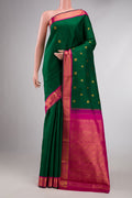 Bottle Green Dual Tone Kanchipuram Silk Saree with Zari Butta on the body and Zari Border displayed on a mannequin