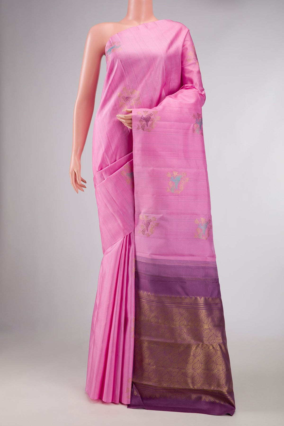 Pure Silk Pure Zari Pink Dual Tone Kanchipuram Saree with Zari And Thread Butta on the body and Without Border displayed on a mannequin