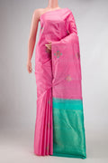 Pure Silk Pure Zari Pink Dual Tone Kanchipuram Saree with Zari And Thread Butta on the body and Without Border displayed on a mannequin
