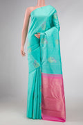 Sea Green Dual Tone Kanchipuram Silk Saree with Zari And Thread Butta on the body and Without Border displayed on a mannequin