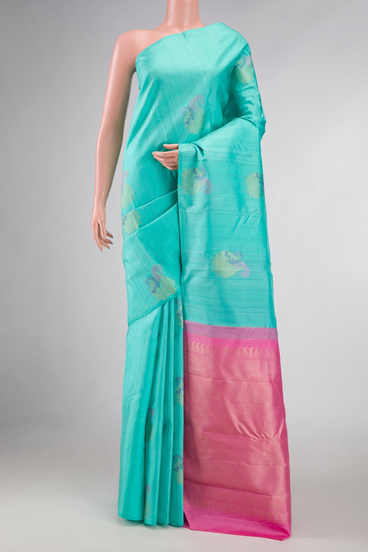 Sea Green Dual Tone Kanchipuram Silk Saree with Zari And Thread Butta on the body and Without Border displayed on a mannequin