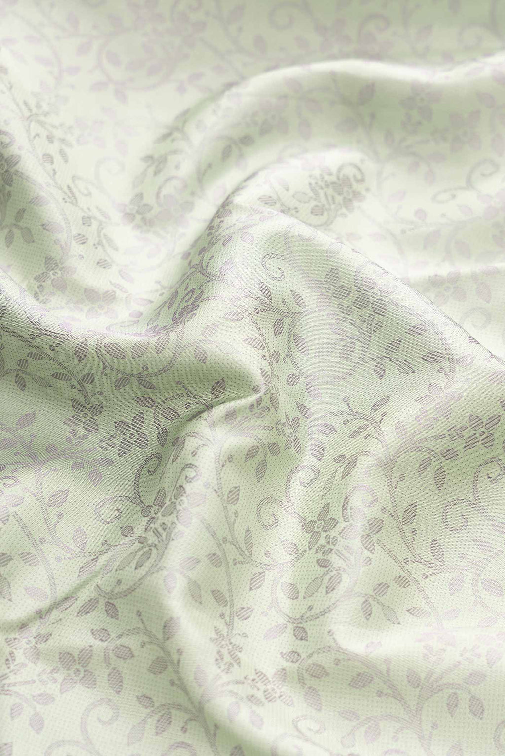 Close up of Pista Green Dual Tone Kanchipuram Silk Saree with Jacquard design on the body and Fancy Border displaying folds