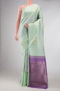 Pista Green Dual Tone Kanchipuram Silk Saree with Jacquard design on the body and Fancy Border displayed on a mannequin