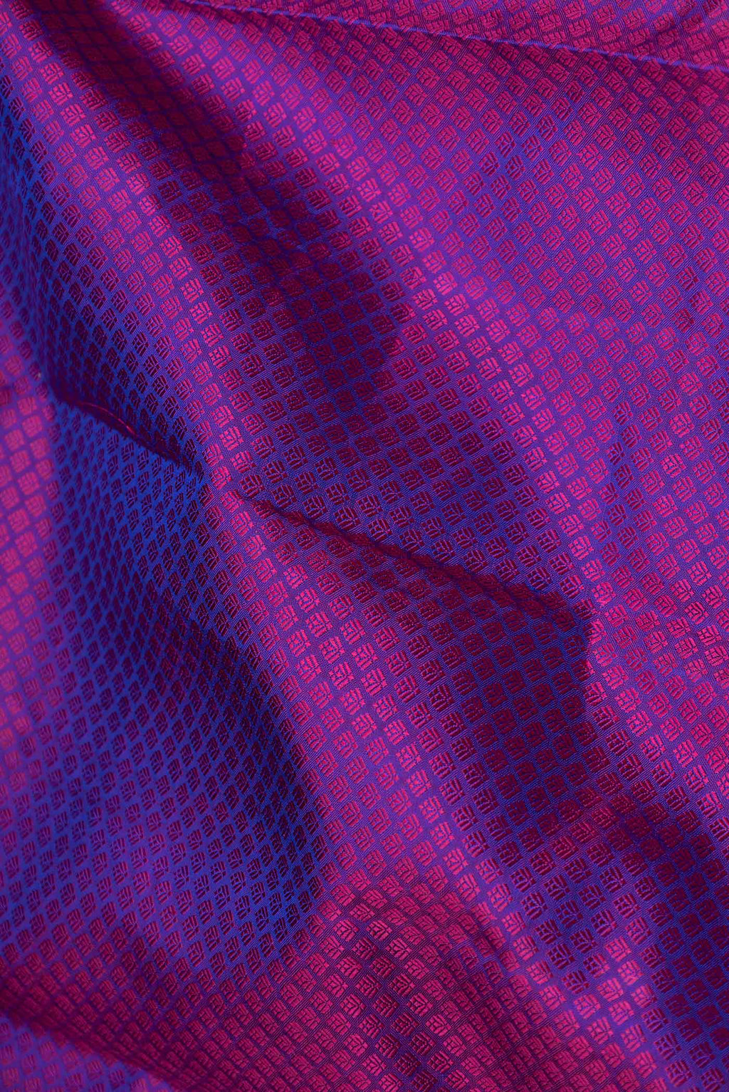 Close up of Purple Dual Tone Kanchipuram Saree with Jacquard design on the body and Zari Border displaying folds