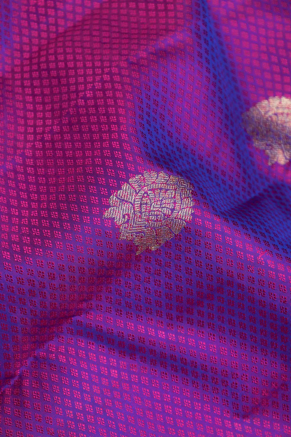 Close up of Purple Dual Tone Kanchipuram Saree with Jacquard With Zari Butta on the body and Zari Border displaying folds