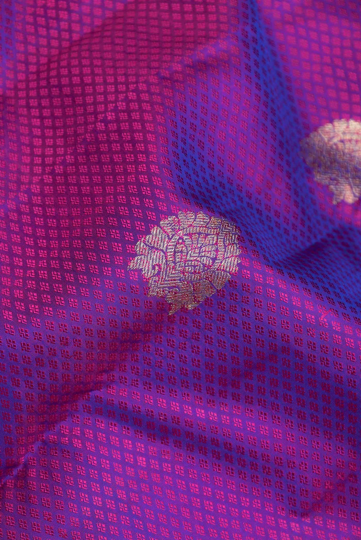 Close up of Purple Dual Tone Kanchipuram Saree with Jacquard With Zari Butta on the body and Zari Border displaying folds