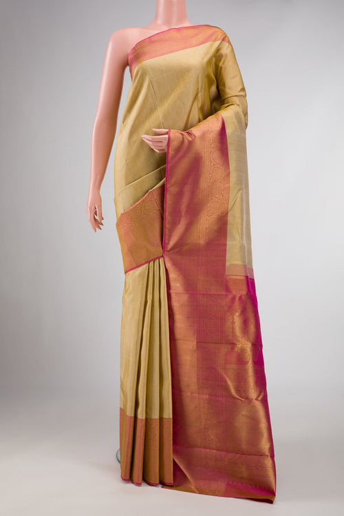 Beige Dual Tone Kanchipuram Silk Saree with Stripes on the body and Zari Border displayed on a mannequin