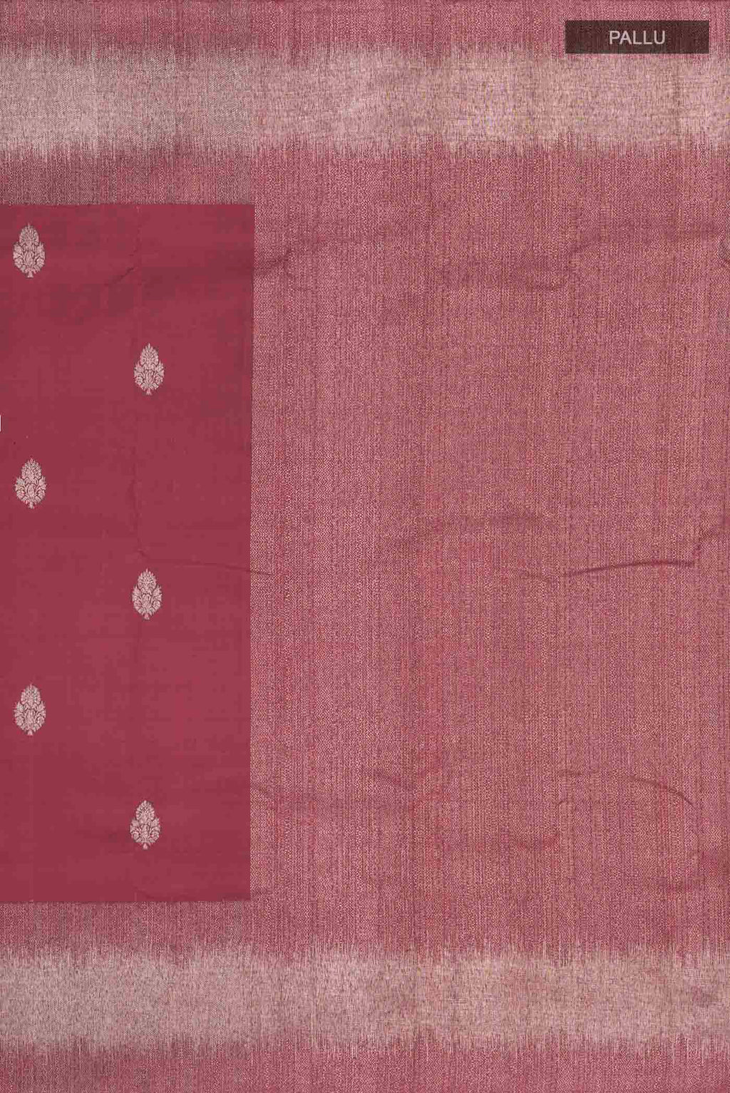 Close up image of the pallu of Maroon Kanchipuram Silk Saree with Zari Butta on the body and Zari Border
