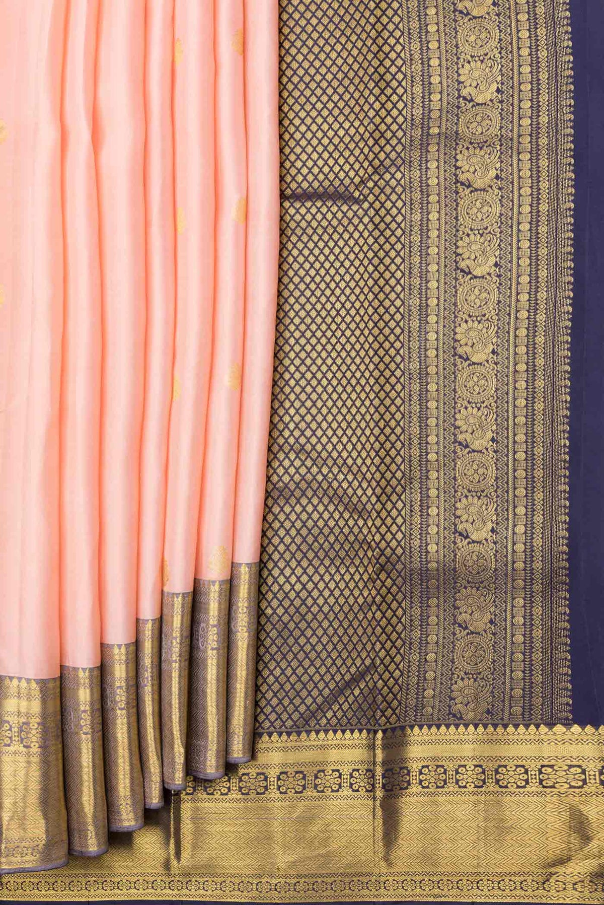 Pleats and pallu of Golden Peach Dual Tone Kanjivaram Saree with Zari Butta on the body and Zari Border. 