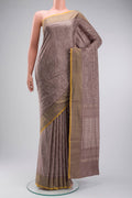 Mauve Pochampally Silk Saree with Pure Ikat on the body and Zari Border displayed on a mannequin