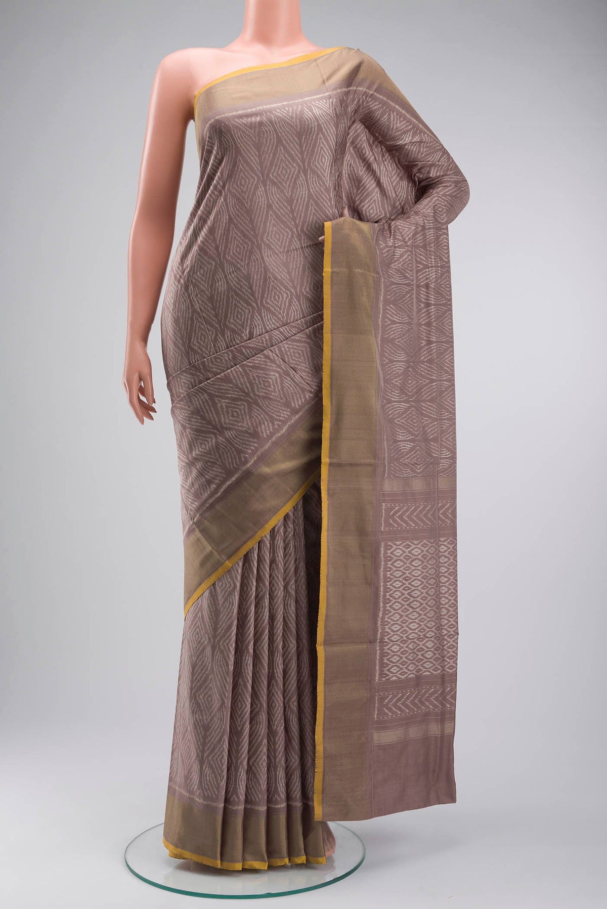 Mauve Pochampally Silk Saree with Pure Ikat on the body and Zari Border displayed on a mannequin