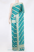Peacock Blue Banarasi Georgette Saree with Zari And Thread Butta on the body and Zari And Thread Border.  displayed on a mannequin