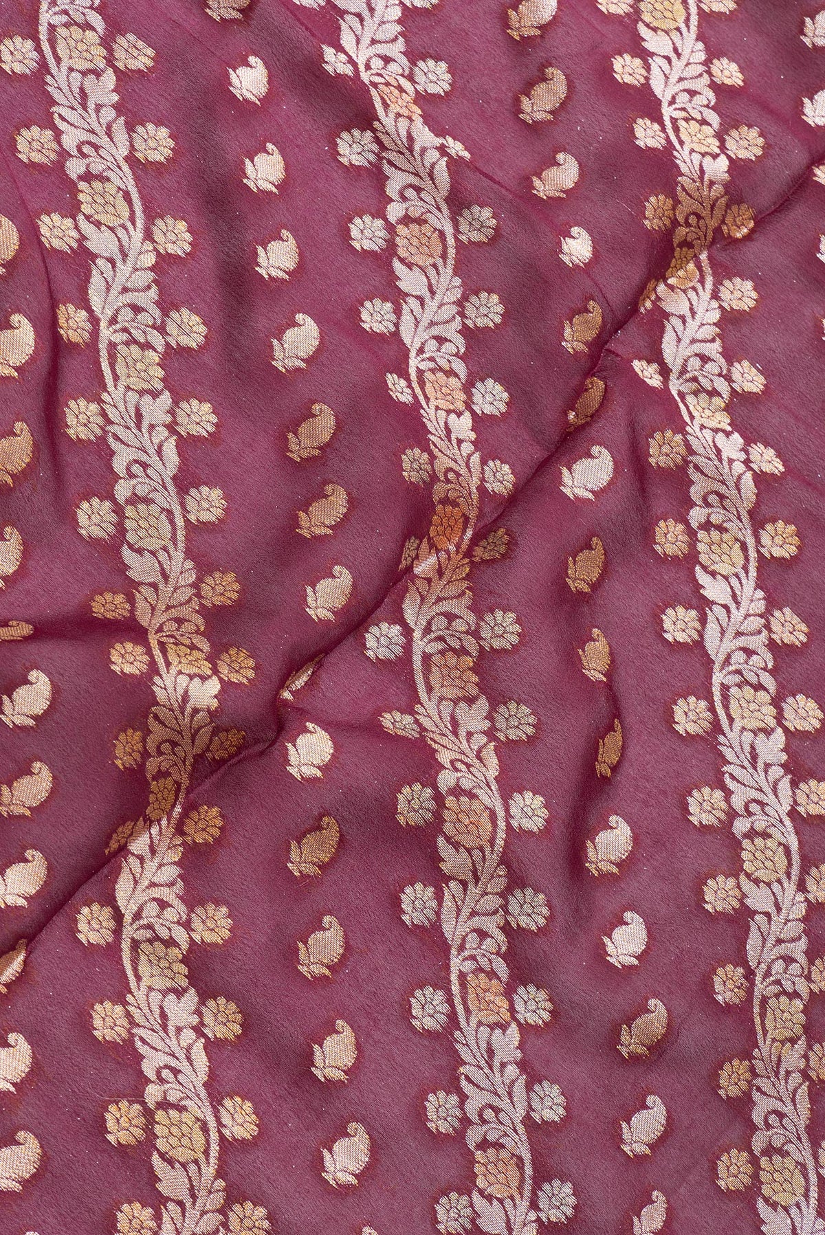 Close up of Maroon Dual Tone Mysore Georgette Saree with Zari Brocade on the body and Thread Border.  displaying folds