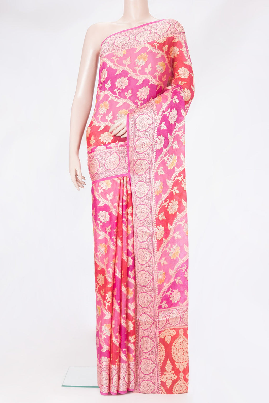 Pink Banarasi Georgette Saree with Zari And Thread Butta on the body and Zari Border.  displayed on a mannequin