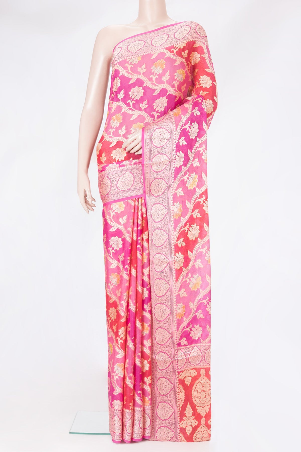 Pink Banarasi Georgette Saree with Zari And Thread Butta on the body and Zari Border.  displayed on a mannequin
