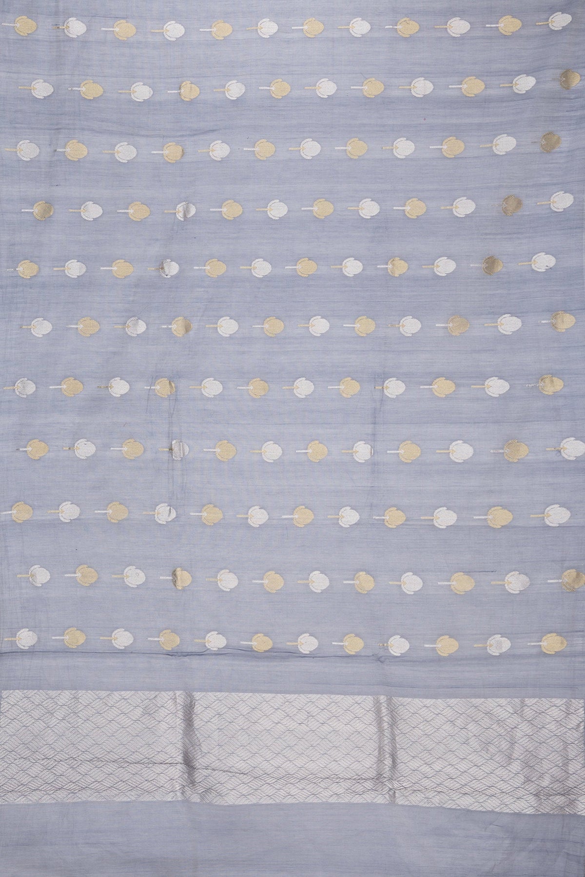 Flat view of Grey Dual Tone Organza Silk Saree with Zari Butta on the body and Zari Border. 