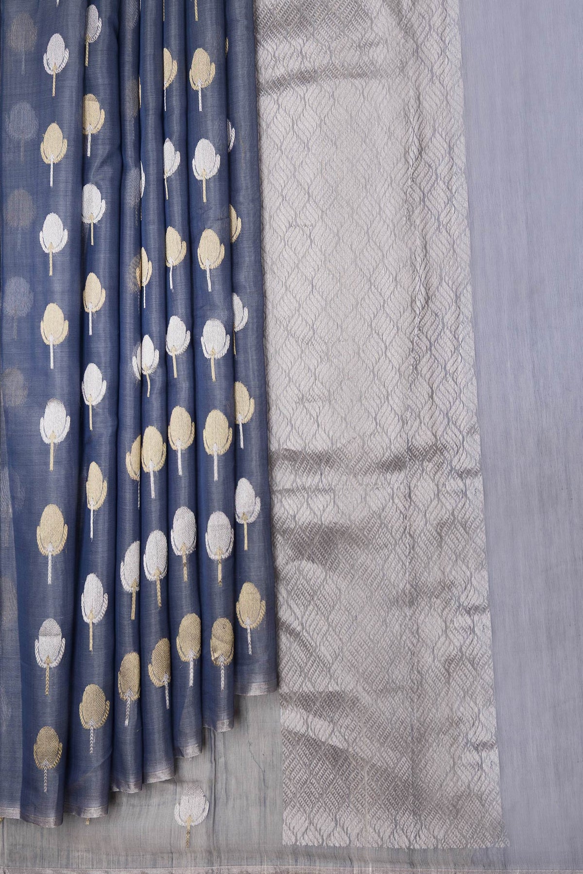 Pleats and pallu of Grey Dual Tone Organza Silk Saree with Zari Butta on the body and Zari Border. 