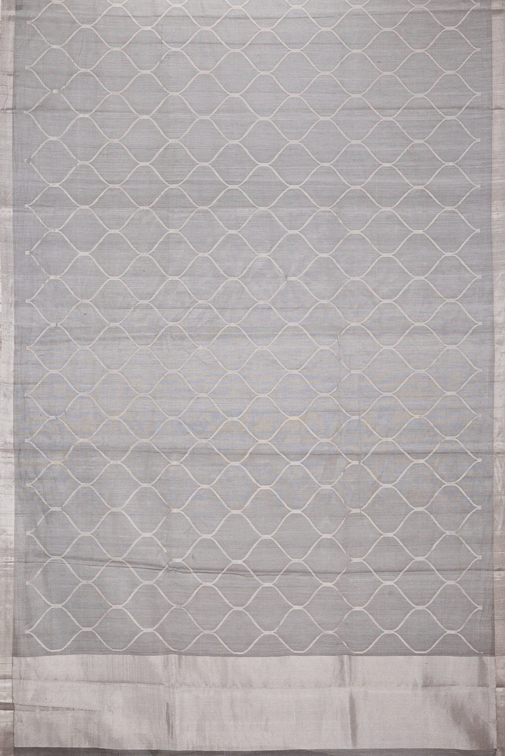 Flat view of Grey Dual Tone Organza Silk Saree with Zari Brocade on the body and Zari Border. 