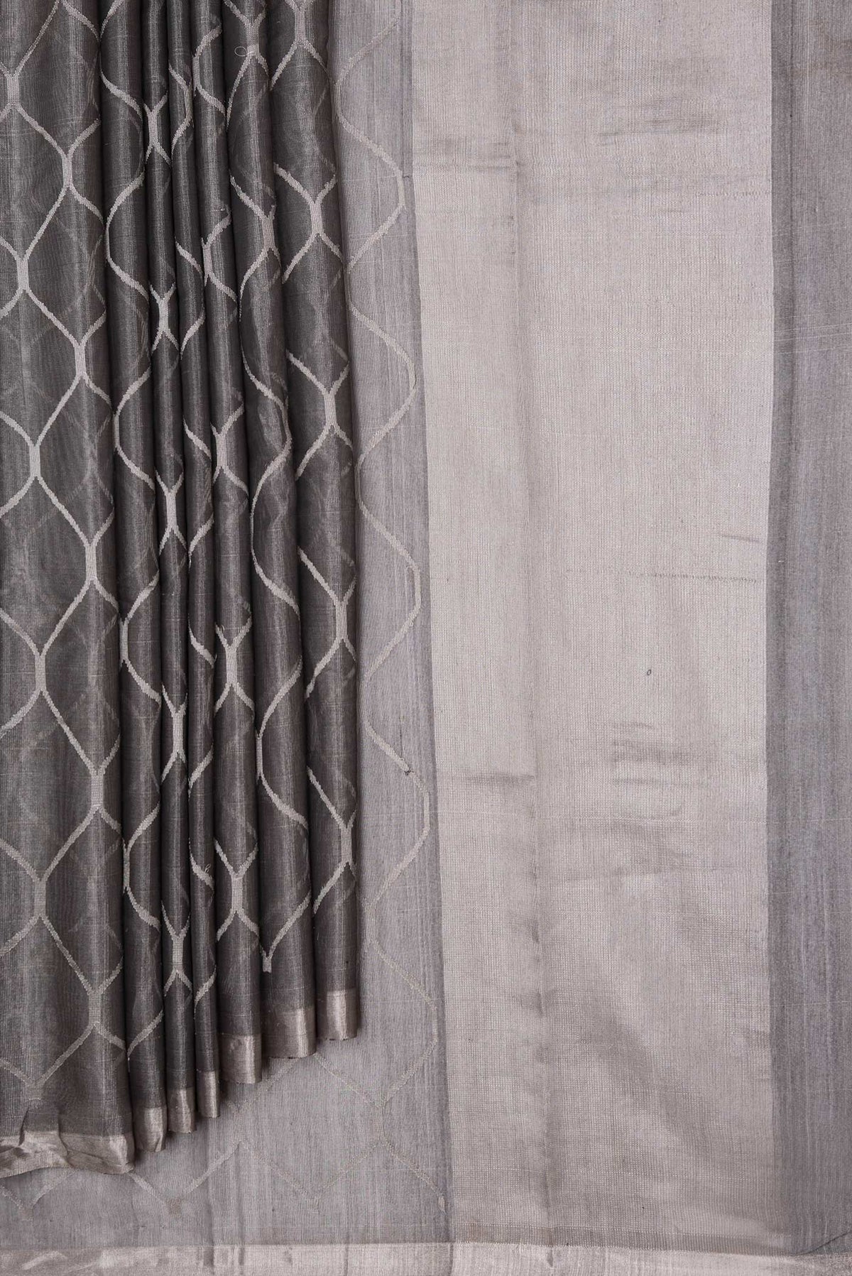 Pleats and pallu of Grey Dual Tone Organza Silk Saree with Zari Brocade on the body and Zari Border. 