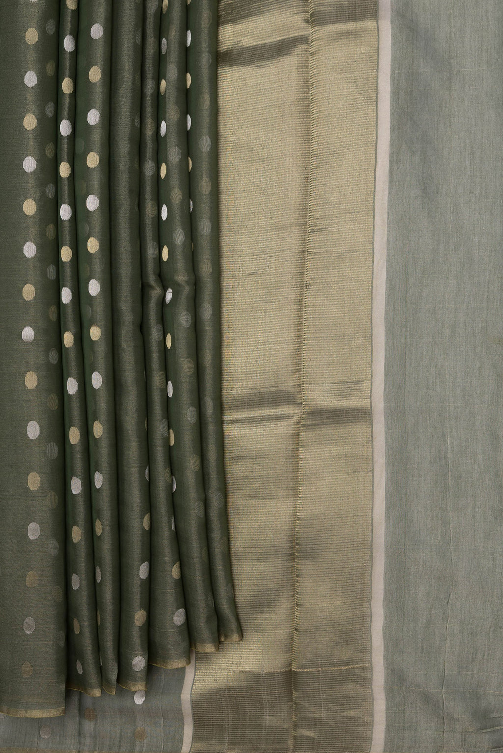 Pleats and pallu of Bottle Green Dual Tone Chanderi Silk Saree with Zari Butta on the body and Thin Zari Line. 