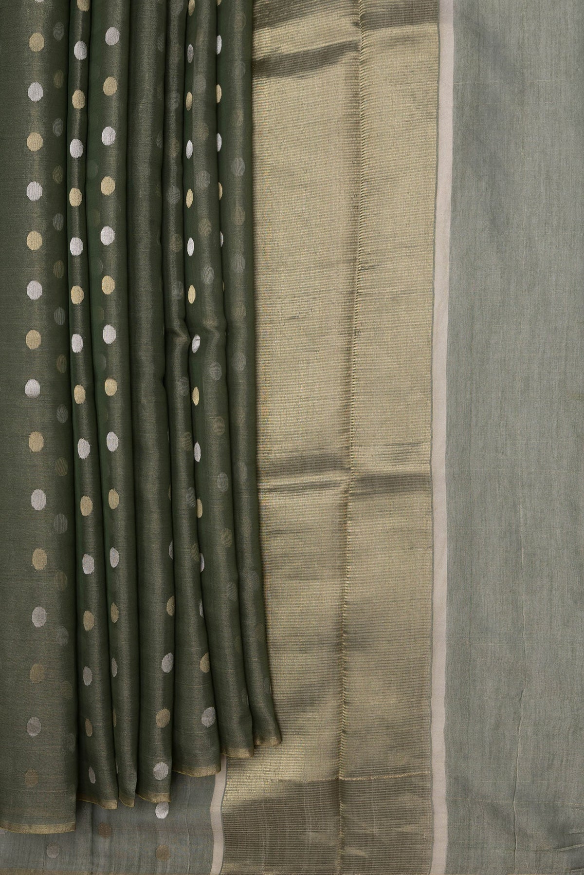 Pleats and pallu of Bottle Green Dual Tone Chanderi Silk Saree with Zari Butta on the body and Thin Zari Line. 