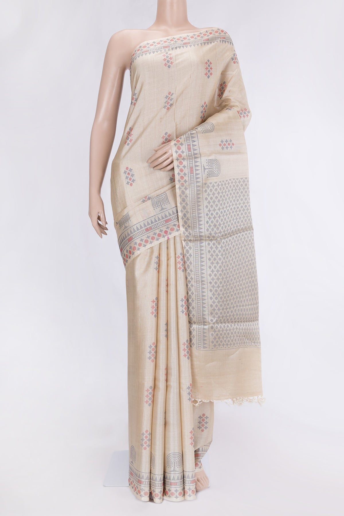 Beige Dual Tone Tussar Silk Saree with Thread Butta on the body and Thread Border.  displayed on a mannequin