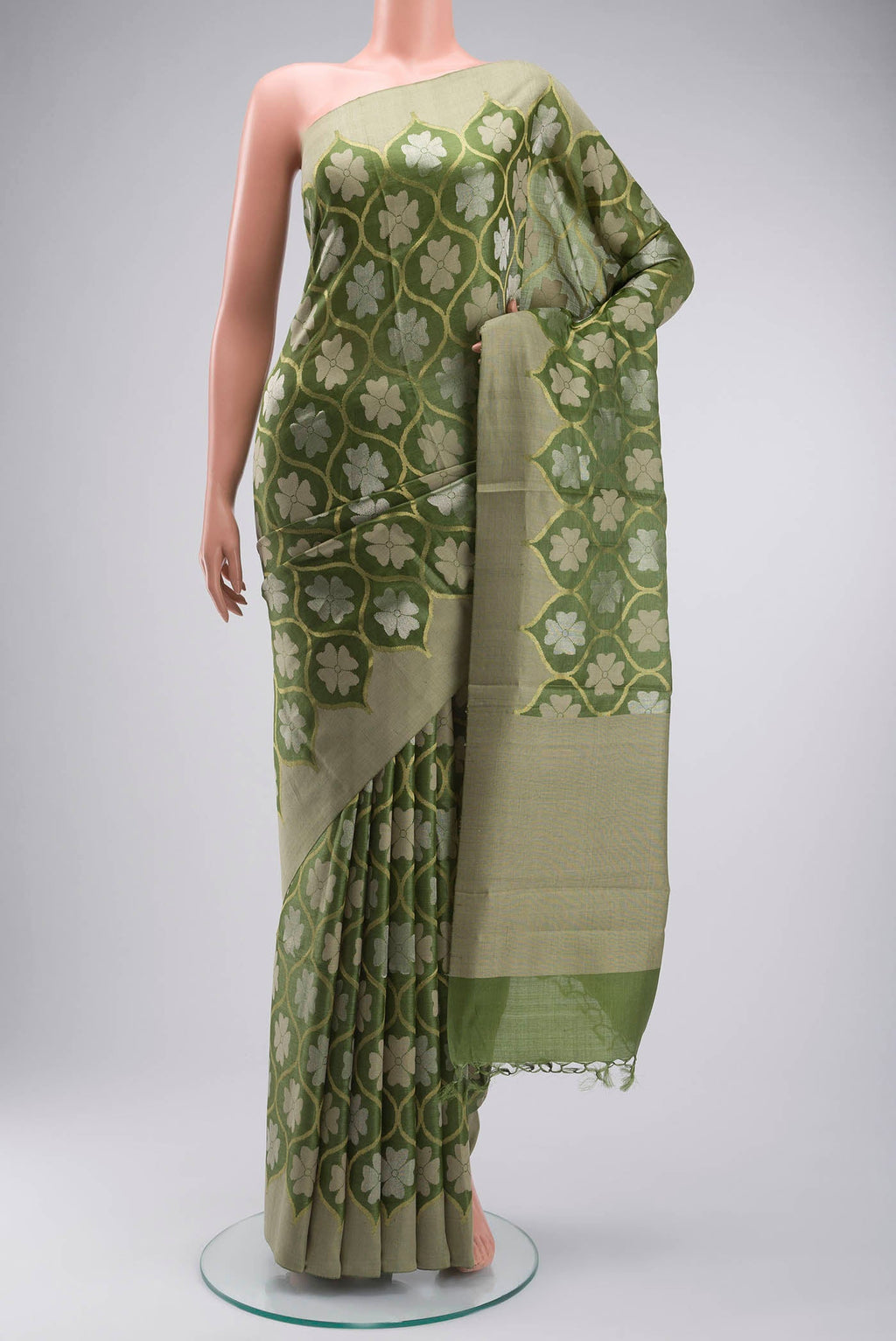 Green Tussar Silk Saree with Zari Butta on the body and Plain Border displayed on a mannequin