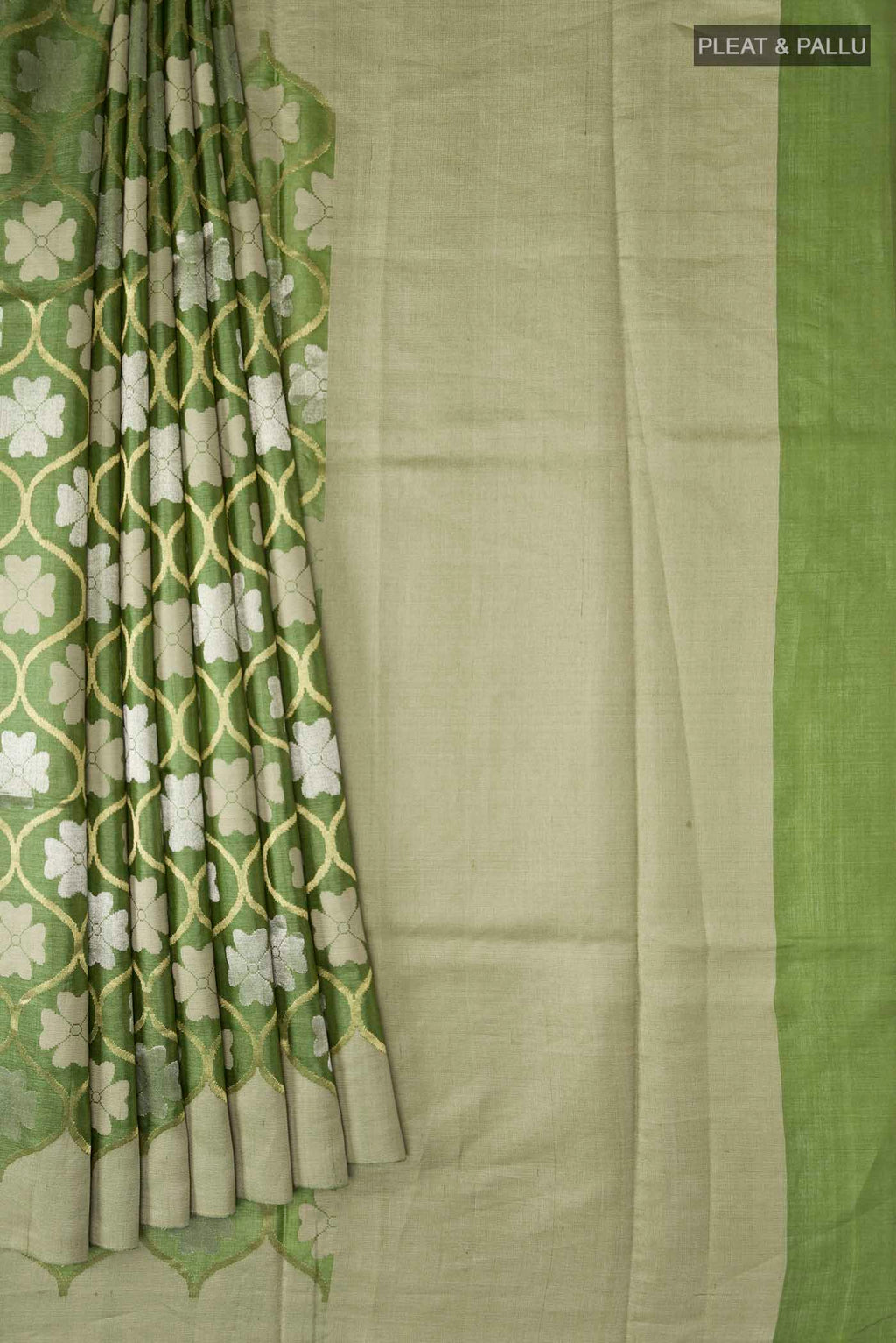 Pleats and pallu of Green Tussar Silk Saree with Zari Butta on the body and Plain Border