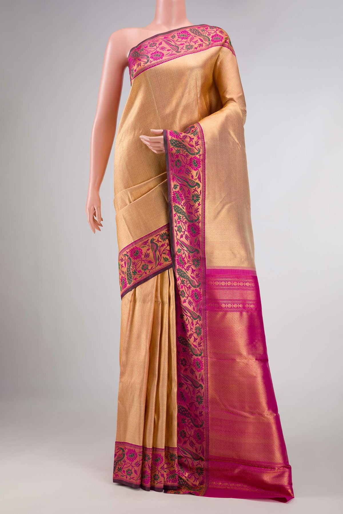Golden Peach Dual Tone Kanchipuram Silk Saree with Zari Brocade on the body and Fancy Border displayed on a mannequin