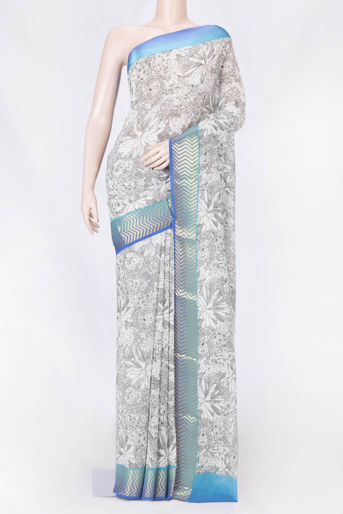 Off White Dual Tone Mysore Georgette Saree with Printed design on the body and Zari Border displayed on a mannequin