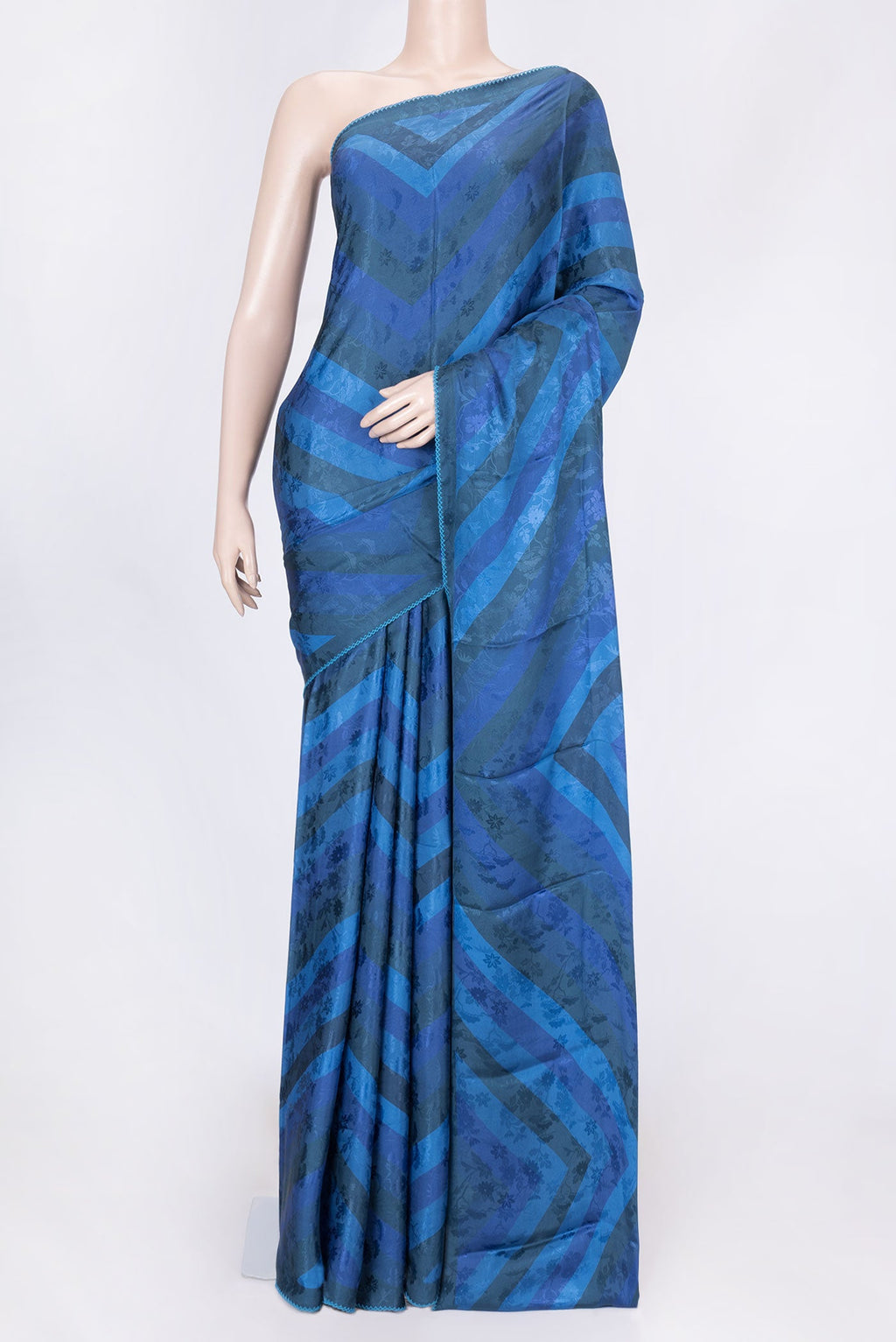 Blue Dual Tone Mysore Crepe Saree with Printed design on the body and Embroidery Border displayed on a mannequin