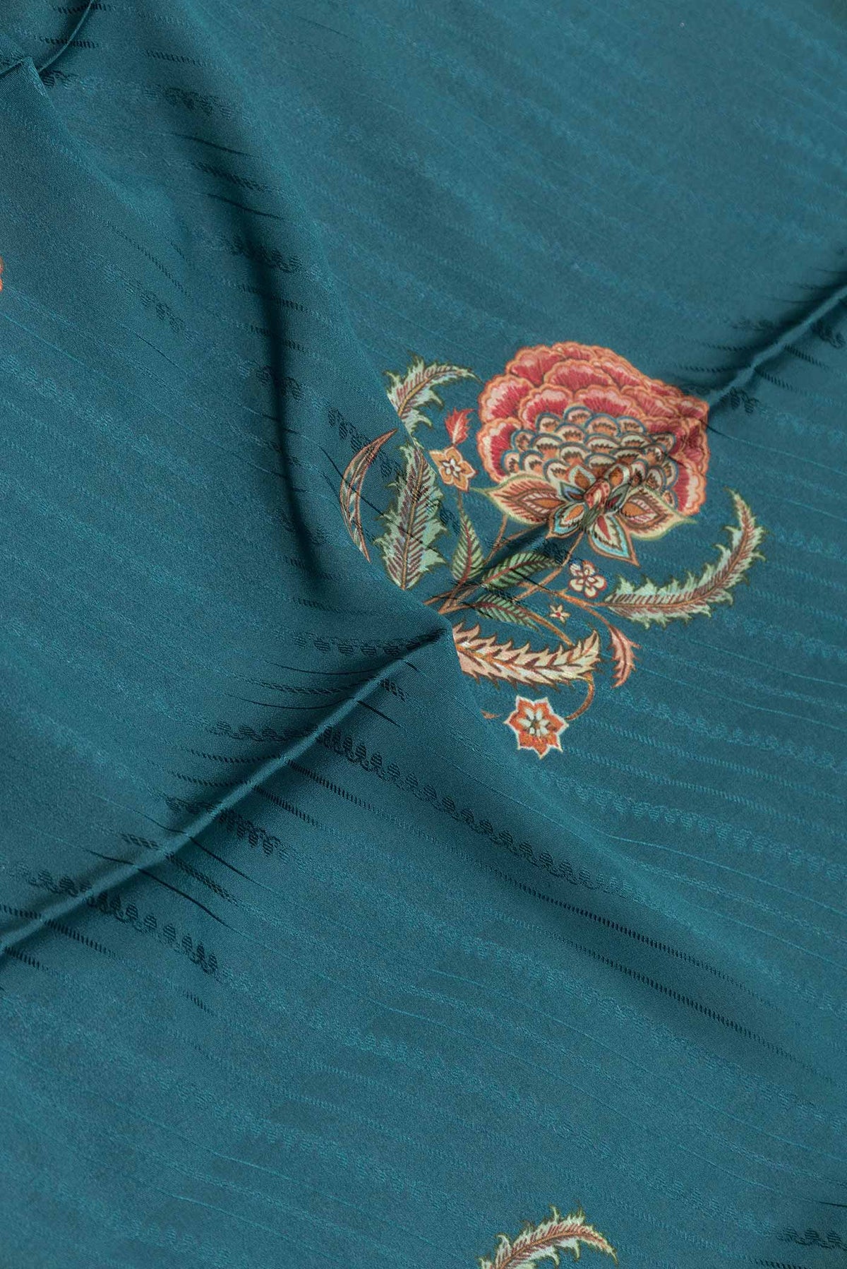 Close up of Green Dual Tone Tussar Silk Saree with Printed design on the body and Zari Border displaying folds