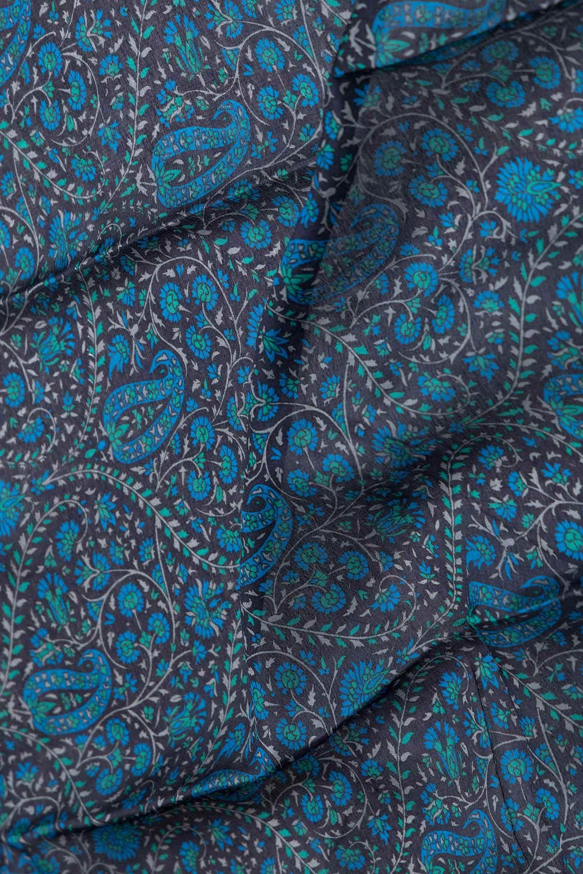 Close up of Black Dual Tone Mysore Crepe Saree with Printed design on the body and Zari Border displaying folds