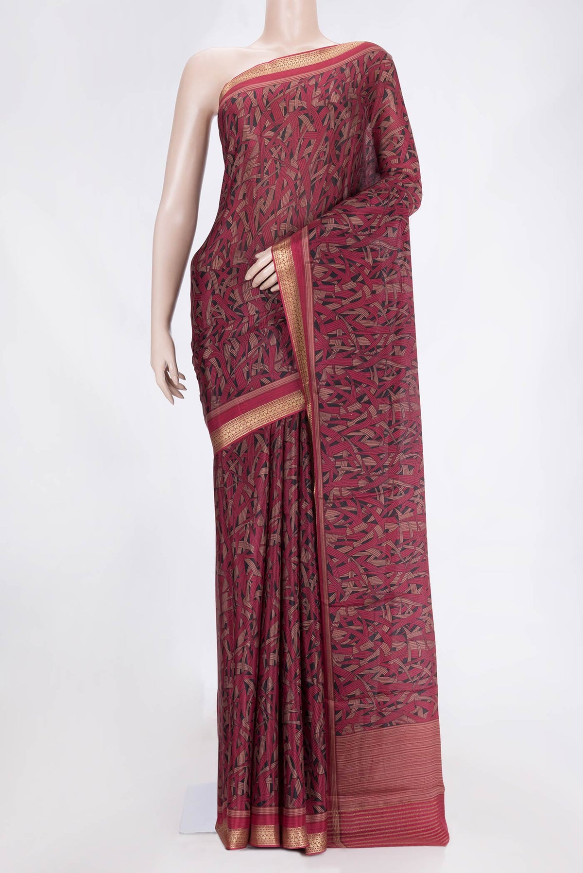 Black Dual Tone Mysore Crepe Saree with Printed design on the body and Zari Border.  displayed on a mannequin
