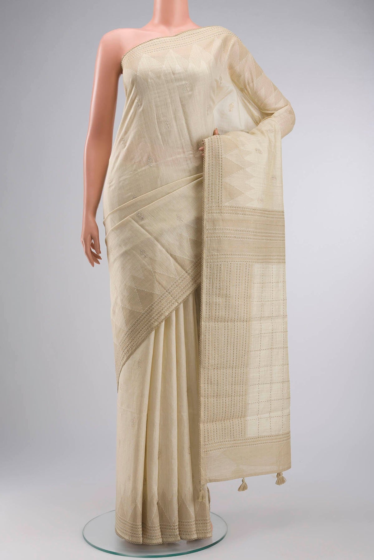 Cream Bhagalpuri Tussar Silk Saree with Embroidery on the body and Embroidery Border displayed on a mannequin