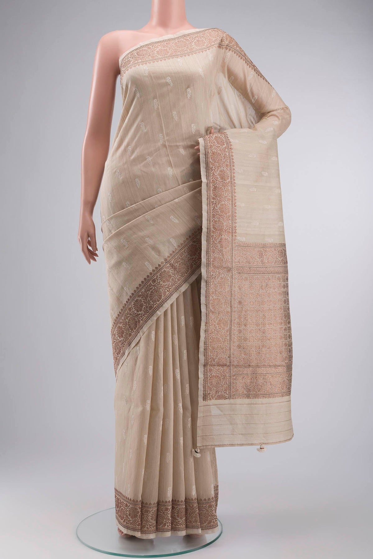Beige Bhagalpuri Tussar Silk Saree with Embroidery on the body and Zari Border displayed on a mannequin