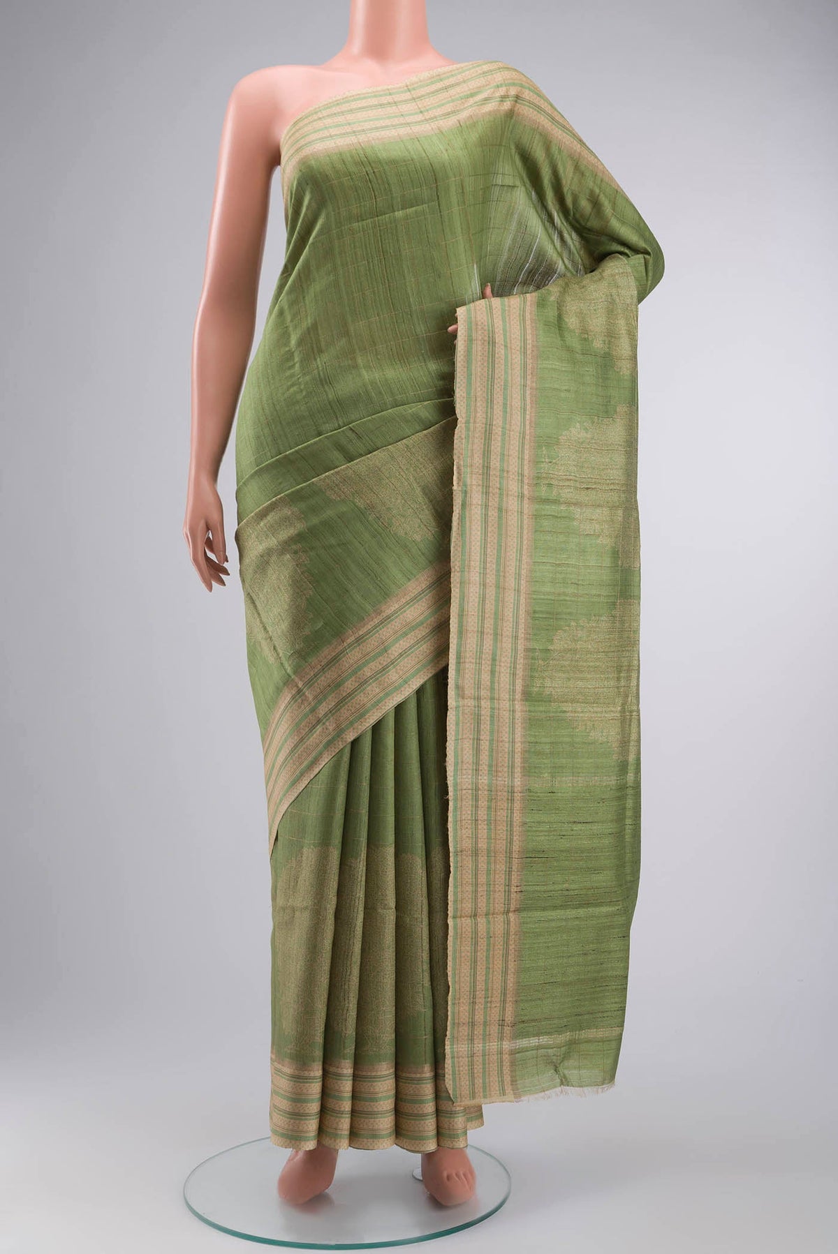 Green Bhagalpuri Tussar Silk Saree with Printed design on the body and Printed Border displayed on a mannequin