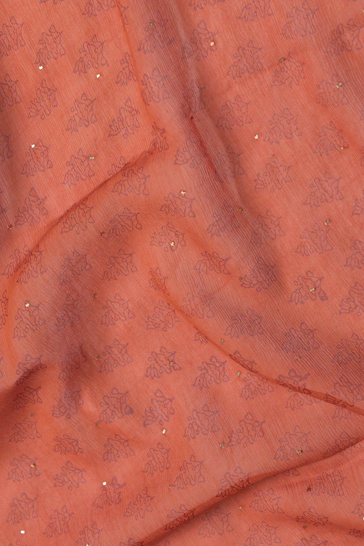 Close up of Brick Orange Dual Tone Mysore Chiffon Saree with Embroidery on the body and Embroidery Border.  displaying folds