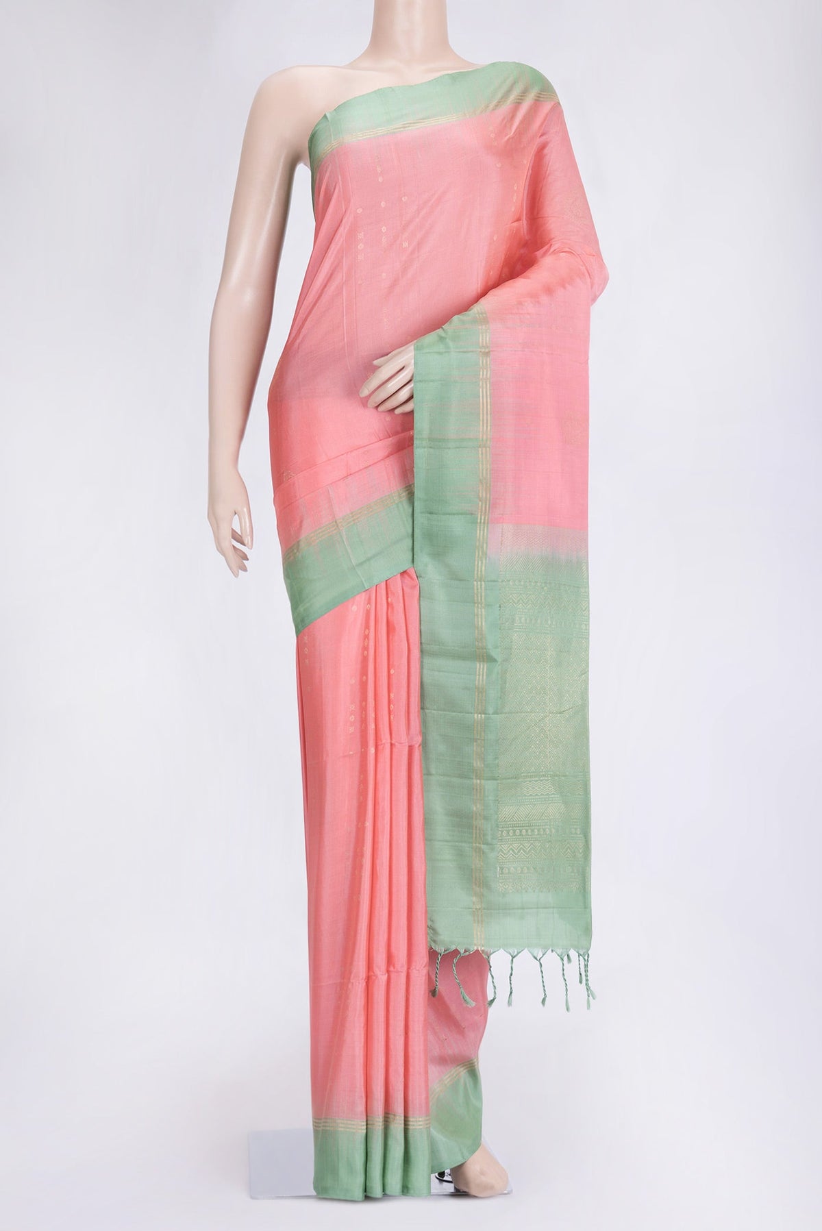 Peach Dual Tone Soft Silk Saree with Zari Butta on the body and Zari Border.  displayed on a mannequin