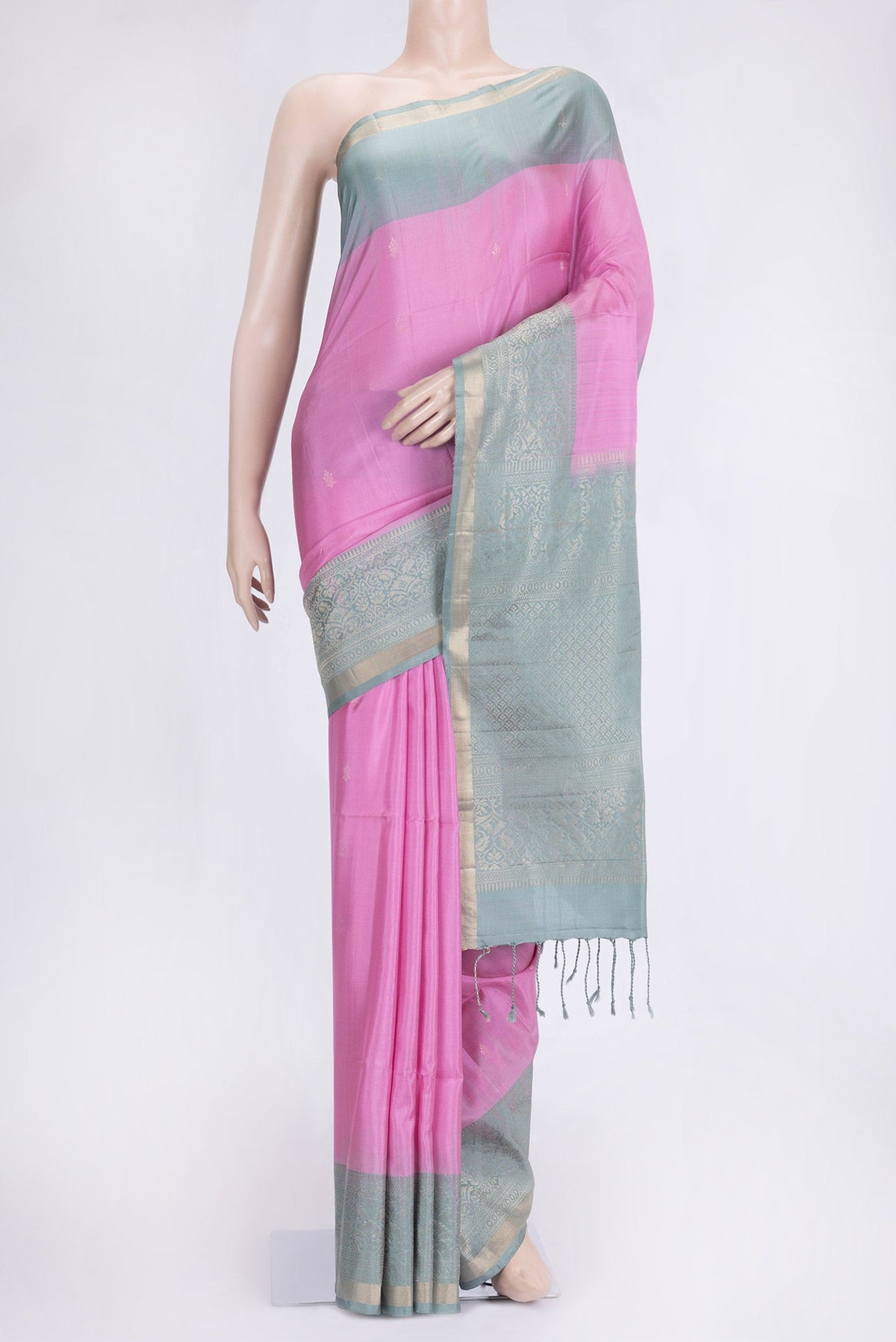 Pink Dual Tone Soft Silk Saree with Zari Butta on the body and Fancy Border.  displayed on a mannequin
