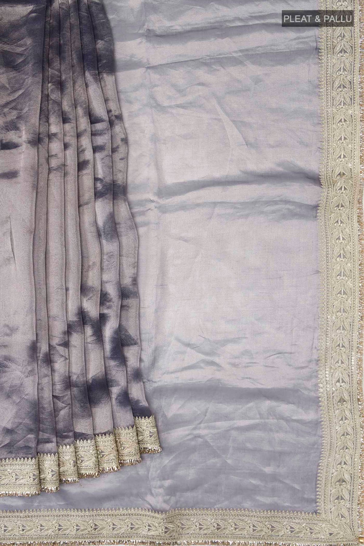 Pleats and pallu of Lilac Tissue Silk Saree with Plain Body and Embroidery Border