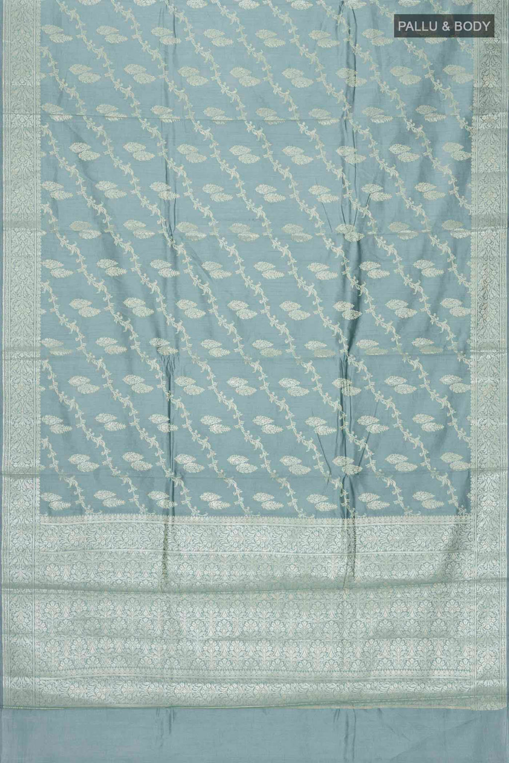 Flat view of Green Banarasi Raw Silk Saree with Zari Butta on the body and Zari Border