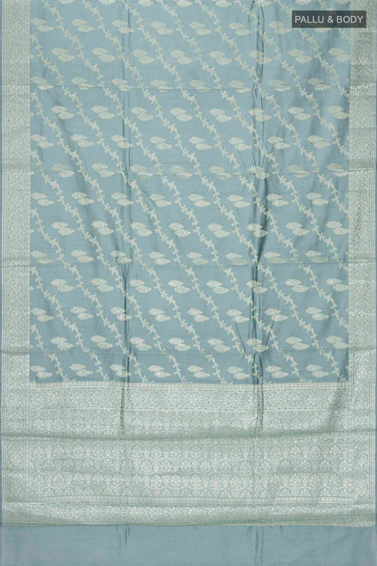 Flat view of Green Banarasi Raw Silk Saree with Zari Butta on the body and Zari Border